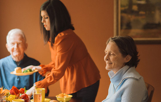 amenities-you-love-2 Senior residents being served lunch at Summerfield of Redlands Memory Care in Redlands, CA