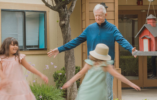 amenities-you-love-3 Senior resident plays with grandchildren at Summerfield of Redlands Memory Care in Redlands, CA