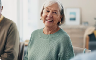 Group of happy elderly people talking in a residential setting.